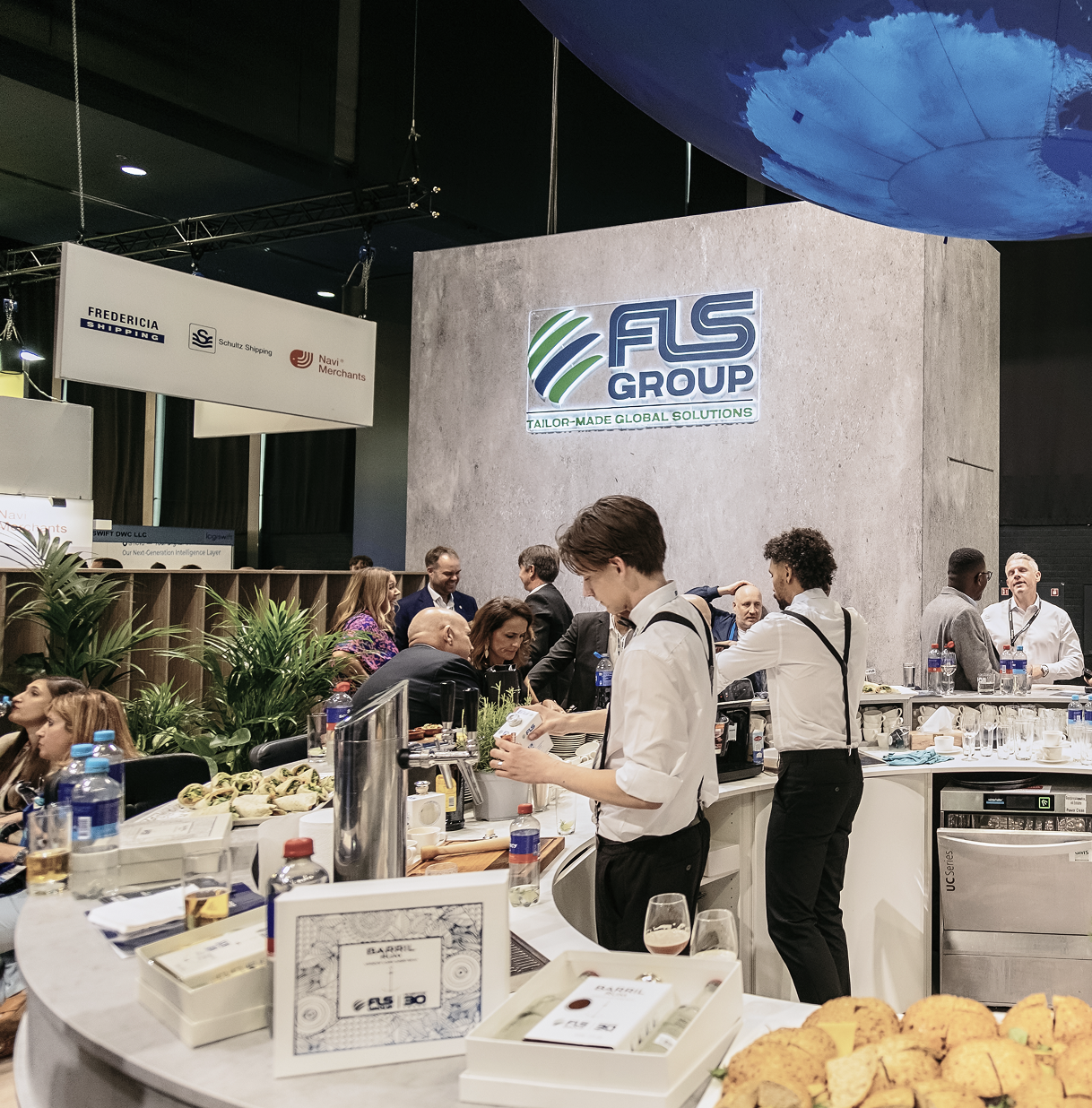 Catering team preparing the FLS Group booth
