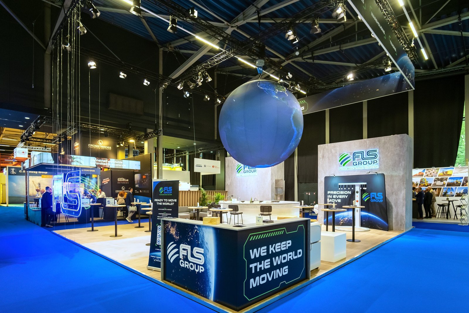 Wide view of the FLS Group booth from the exhibition aisle