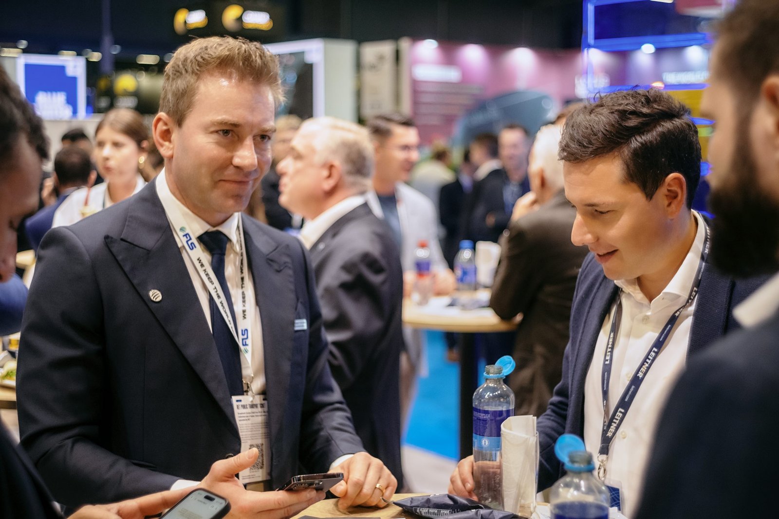 Attendees networking with FLS Group at Breakbulk Europe