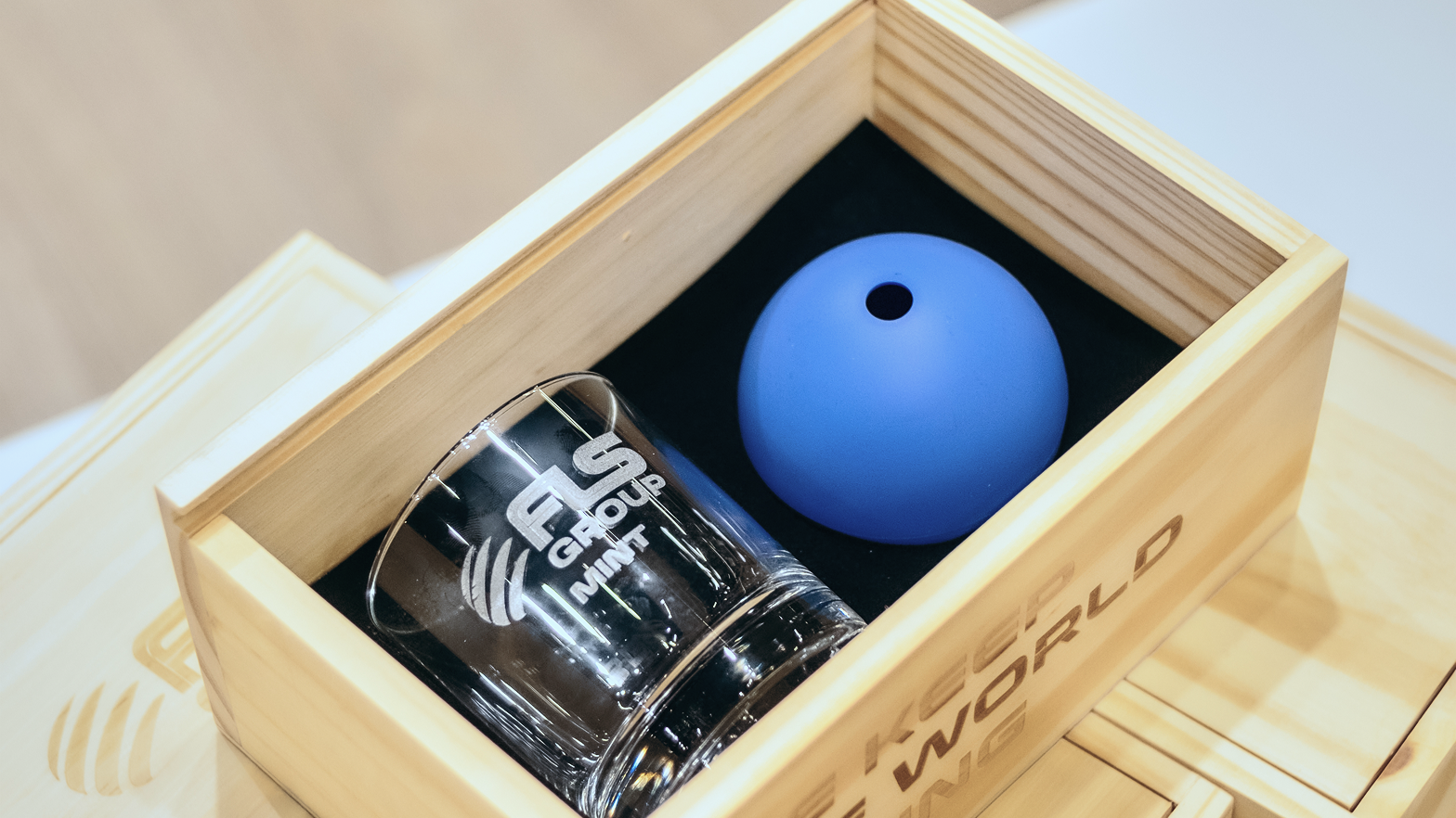 FLS Group branded gifts in a wooden presentation box